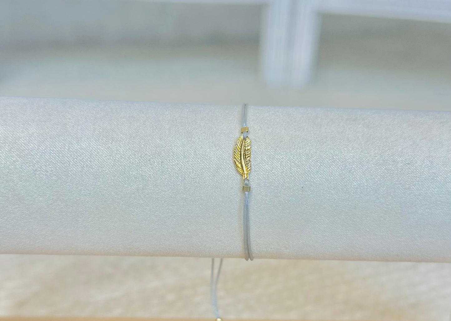 Grey Thread Bracelet with Gold Plated Feather